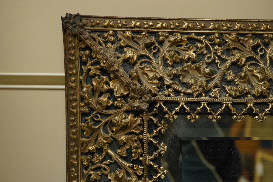 A period-style embossed metal easel mirror, 41cm x 50cm. Condition - easel stand missing now converted to a wall mirror